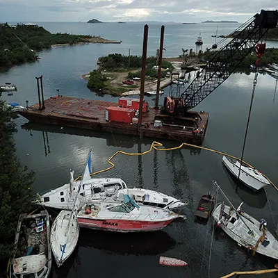 Several recreational boats are reined in by a floating line